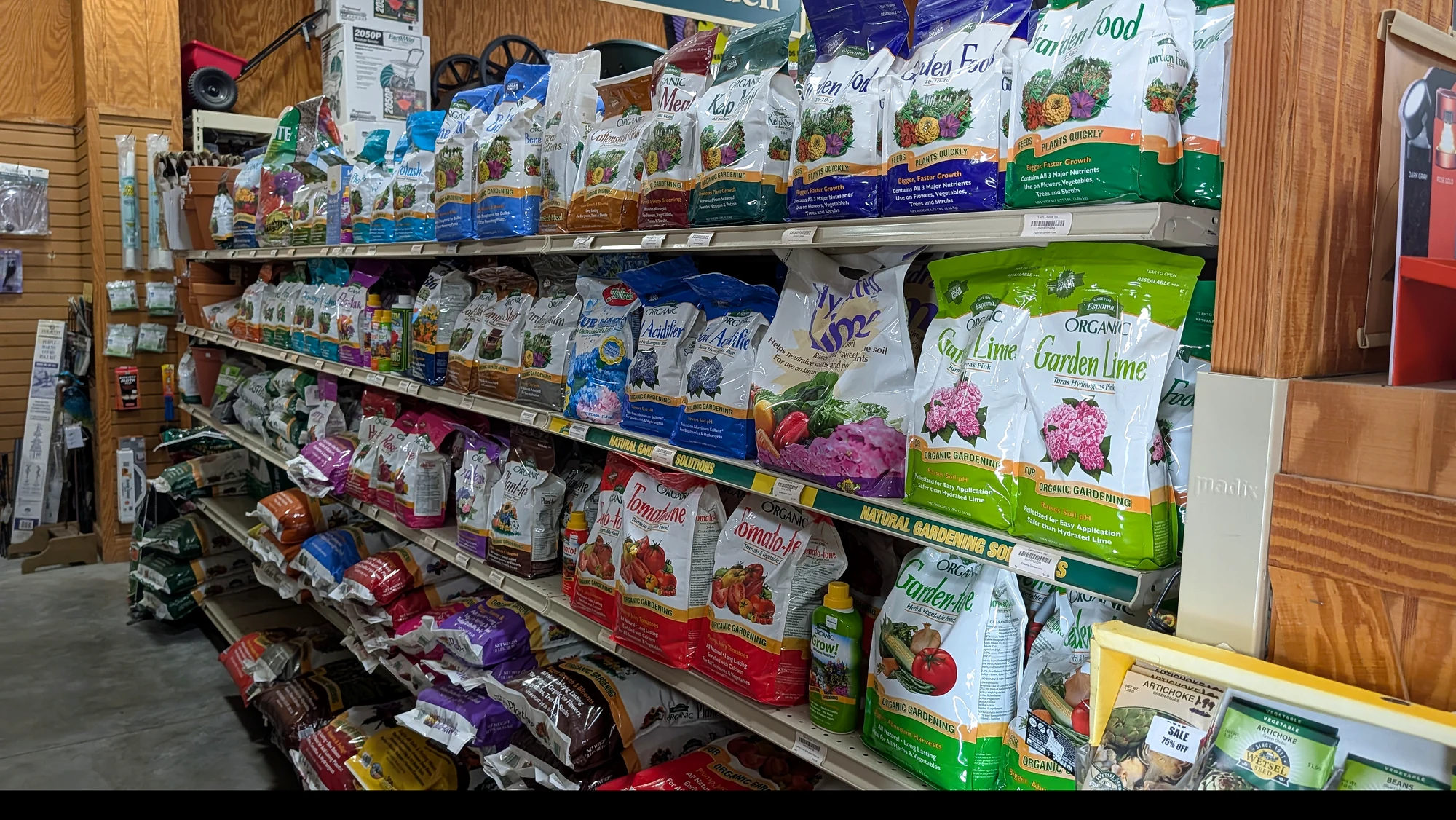 Lawn and garden products photographed inside Farm Choice